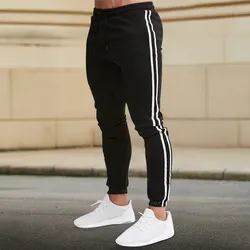 Pantaloni casual da uomo primaverili e autunnali 2024 Nuova tendenza Versione coreana Strisce bianche e nere Slim LEGGING Tendenza Piedi legati