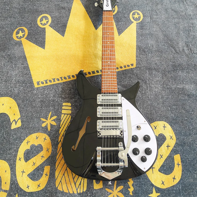 Semi-hollow electric guitar, cool black vintage-shaped electric guitar! Three pickups, big tremolo bar, stands out instantly on