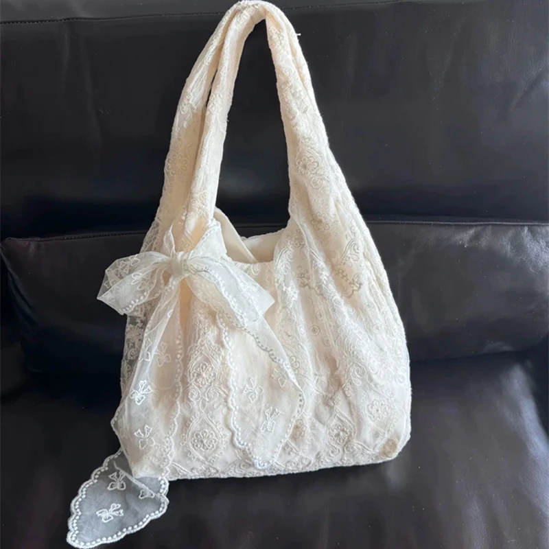 

Korean fresh lace flower canvas tote bag women's large capacity shoulder commuter underarm bag college style