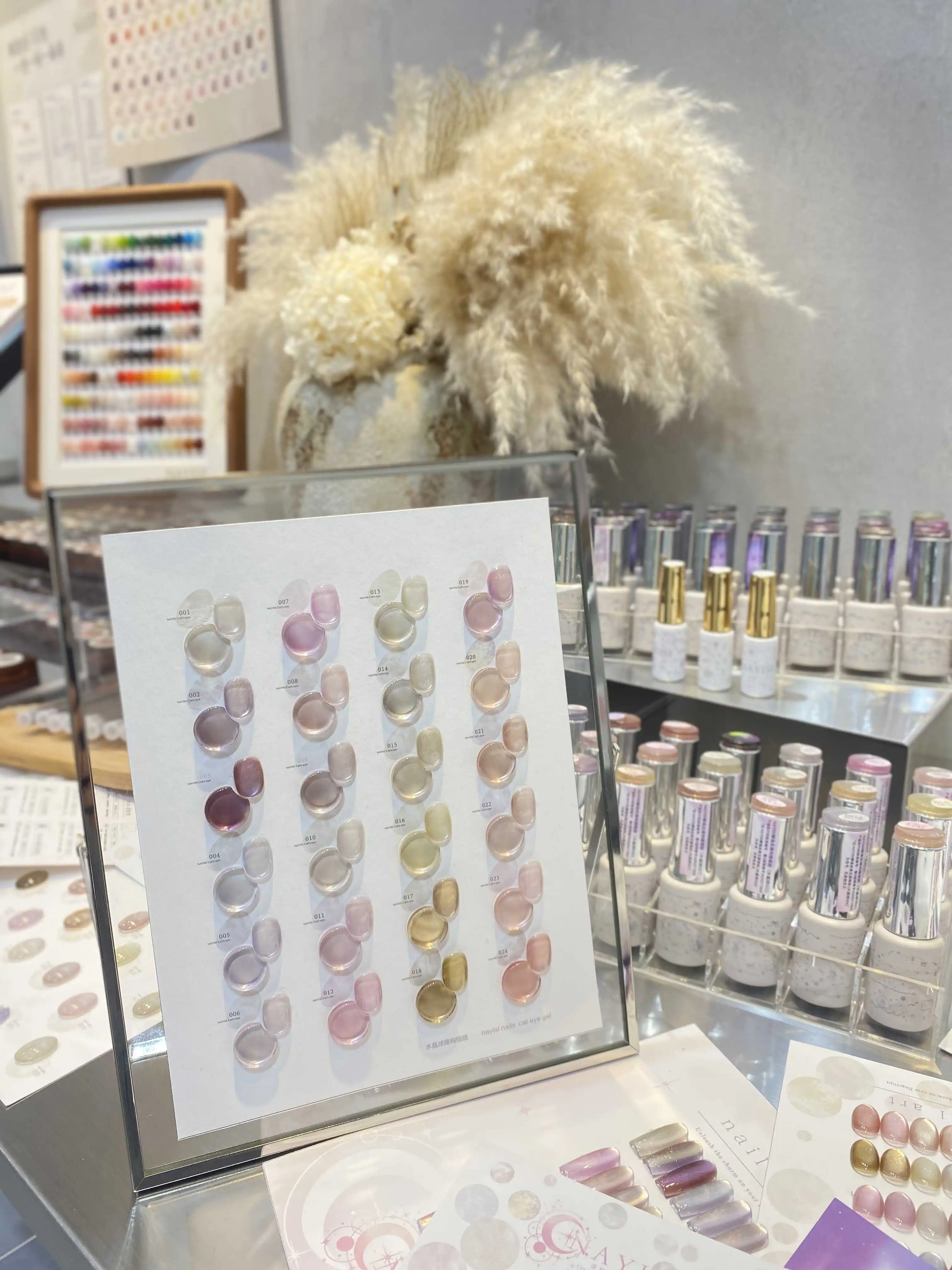 NAYISI 2025 nuevo juego de Gel de uñas de ojo de gato de luz de luna de 24 colores sin HEMA Gel UV no tóxico sin TPO gran oferta botella de producto de exposición de belleza