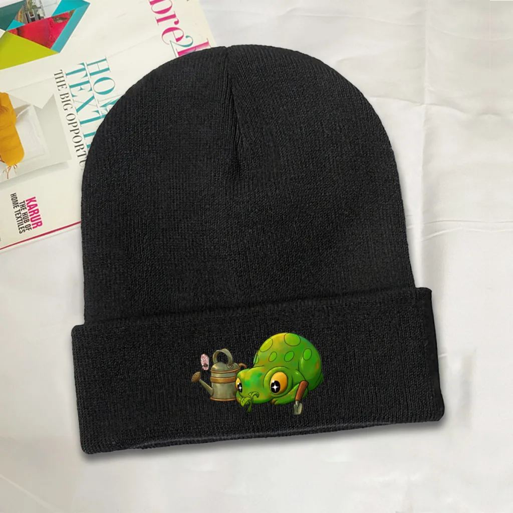 cute frog looking at sprouting plant from garden beginning of spring Knitted Hat Women's Men's Beanie Winter Hats Polyester