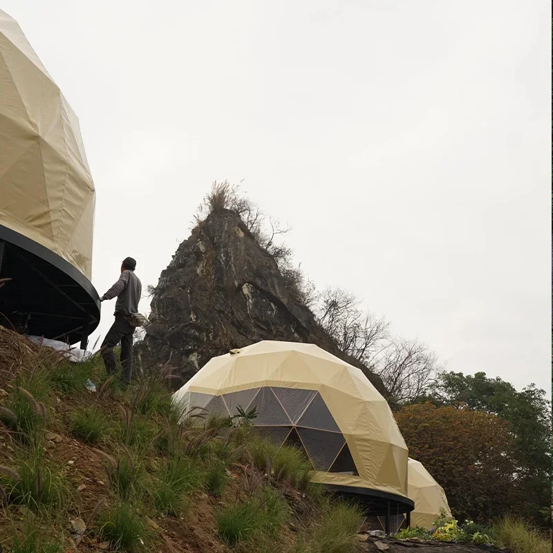 A luxury dome tent with a private bathroom and kitchenette, ideal for a hotel-style outdoor stay