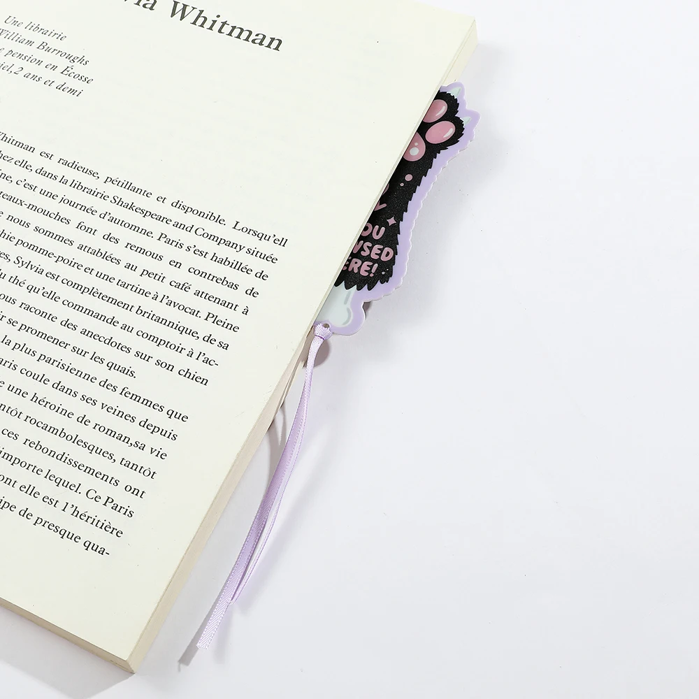 Cute cartoon purple ribbon bookmark with dog paw and cat paw printed on it, an ideal reading gift for dog cat bookworms