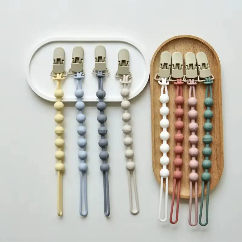 

Adjustable Silicone Chain Baby Pacifier New Solid Color Spring Silicone Pacifier Clip Teeth Grinding Stick Toy Anti Loss Rope
