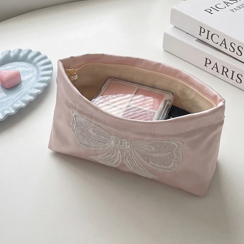 Pink satin embroidered bow cosmetic bag portable pearl zipper storage bag Korean portable cosmetic bag