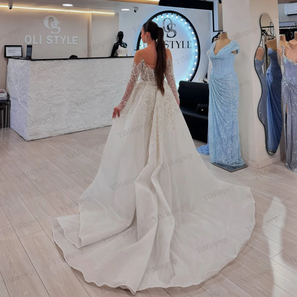 Vestidos de novia de sirena de lujo 2025 con tren desmontable, vestidos de novia con cuentas de cristales de manga larga, corsé con cuello redondo personalizado