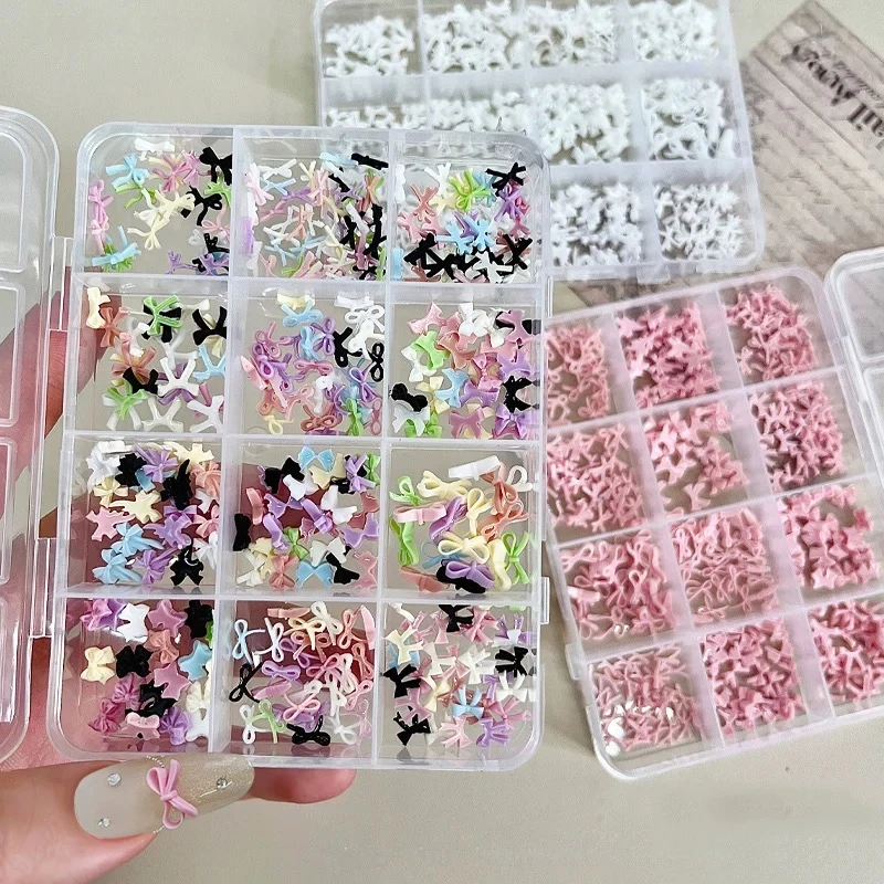 

12-compartment mini bow nail art tools and accessories, mixed sizes, black, white, pink bow ties, nail rhinestones and accessori