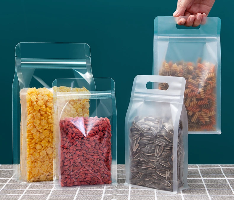 10/50 Stück Lebensmittelverpackungen, Druckverschlussbeutel, transparent, mit Griff, aufstehend, versiegelt, für die Aufbewahrung von Süßigkeiten, Nüssen, wiederverwendbarer Druckverschlussbeutel – Detail 1