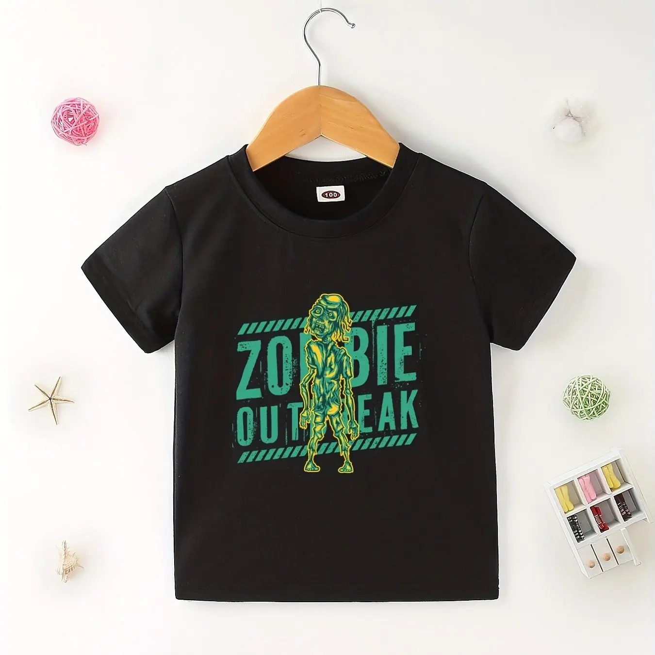 

Kids Halloween T-Shirt Featuring Humorous Zombie Design and "Zombie Outbreak" Text in Soft Cotton Ideal for Festive Celebrations