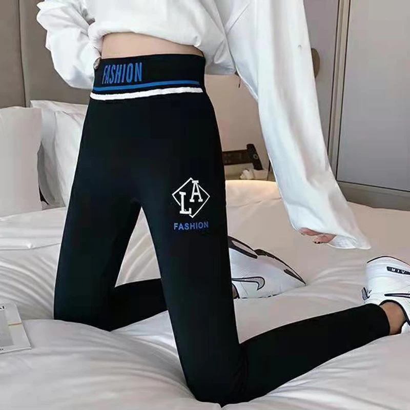 Streetwear wysokie Spandex damskie seksowne Slim, czarny z nadrukiem litery Empire Fashion sportowe spodnie do jogi dziewczęce obcisłe spodnie Fitness