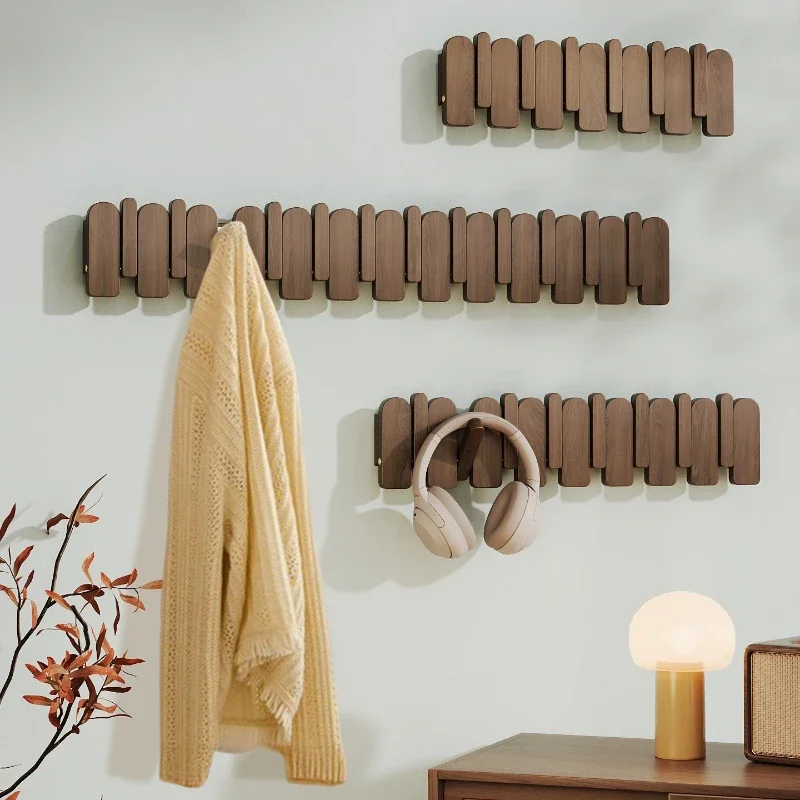 

Piano keys on the wall hang a hanger at the entrance to the door, and a solid wood hook coat rack