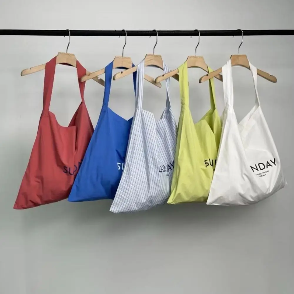 Bolso de hombro de lona con estampado de letras para mujer, bolso de mano de versión coreana, bolso de axila de alta capacidad, nuevo estilo versátil