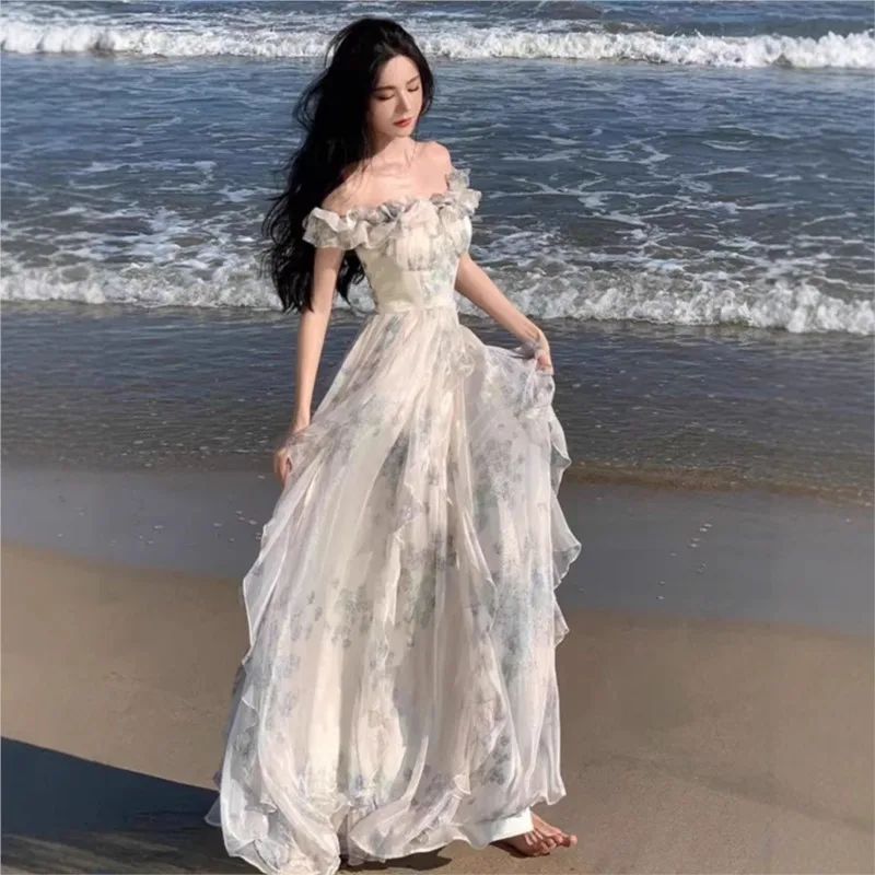 Off-the-shoulder beach dress with a French ruffle hem, a flowing fairy-style dress with a seaside holiday vibe.