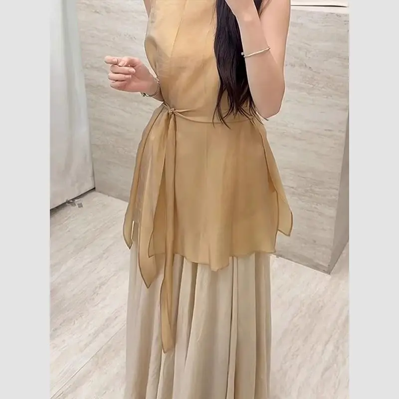 Nuevo conjunto pequeño y fragante de lujo de dos piezas para mujer, moda de verano, blusa sin mangas con cordones, Top + falda larga acampanada, traje elegante