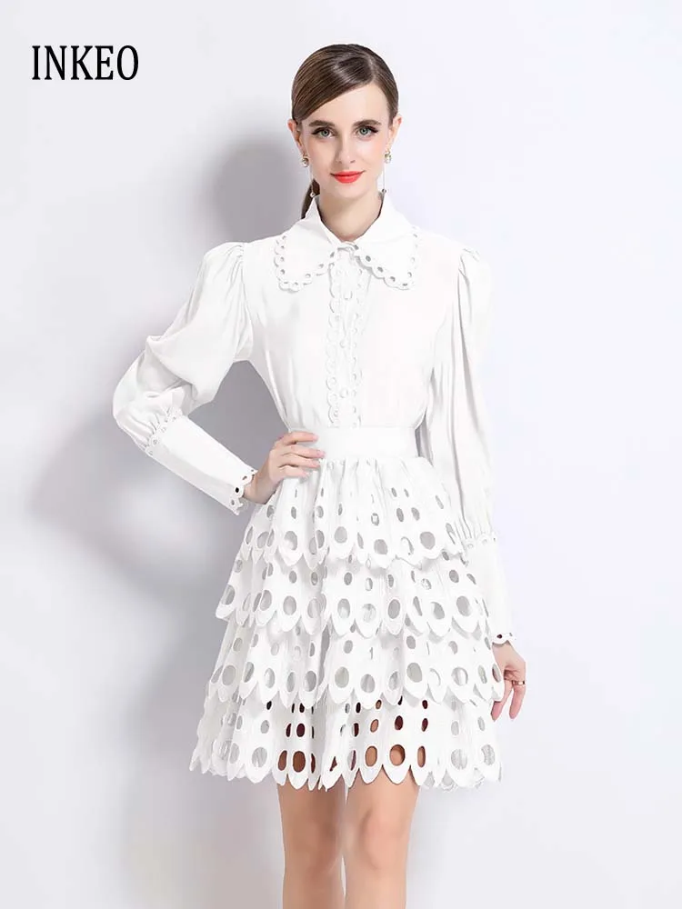 

Роскошный кружевной комплект из 2 предметов с вырезами. Женская новая белая рубашка с длинными рукавами 2025 года и мини-ярусная юбка. Женский наряд. Стильный INKEO 5T095