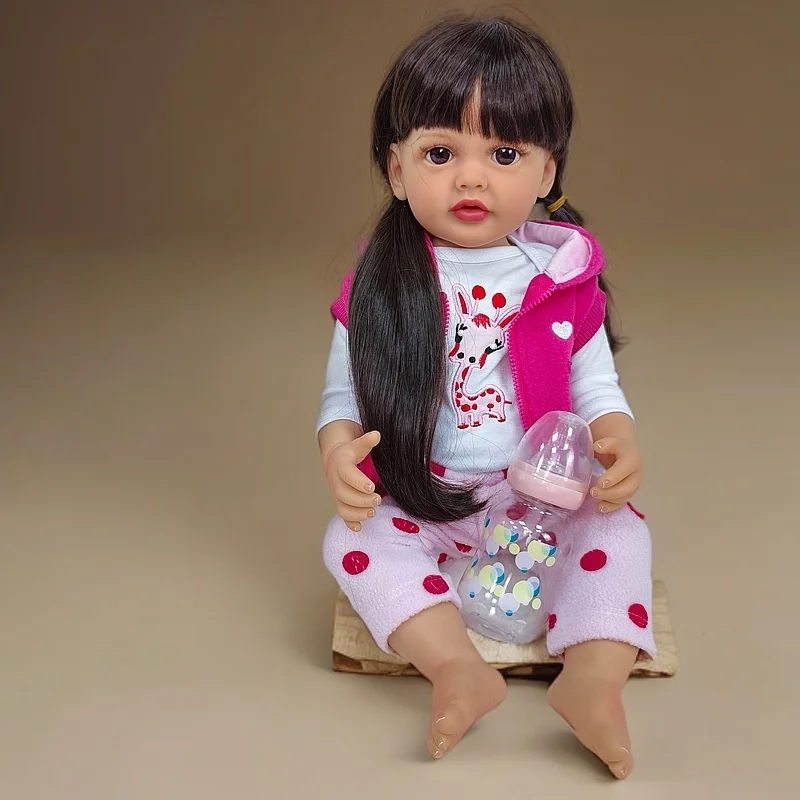 Muñeca Reborn Girl de 22 pulgadas, material de vinilo, pelo largo y liso negro, conjunto de ropa rosa, ojos exquisitos, poseible, caja de regalo