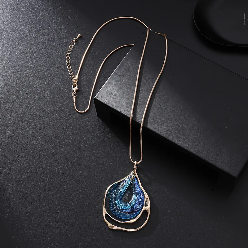 Deep Blue Gradient Crystal Pendant Wavy Edge Frame Long Snake Chain Statement Jewelry Celestial Inspired Evening Neckwear Gift
