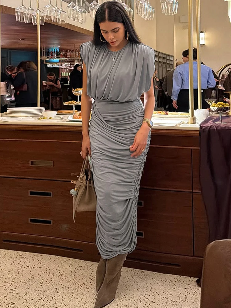 

Kliou Элегантный комплект из 2 предметов с рюшами для женщин 2026, весенний новый стиль, укороченный топ без рукавов с круглым вырезом + длинные юбки с эластичной резинкой на талии, простые костюмы