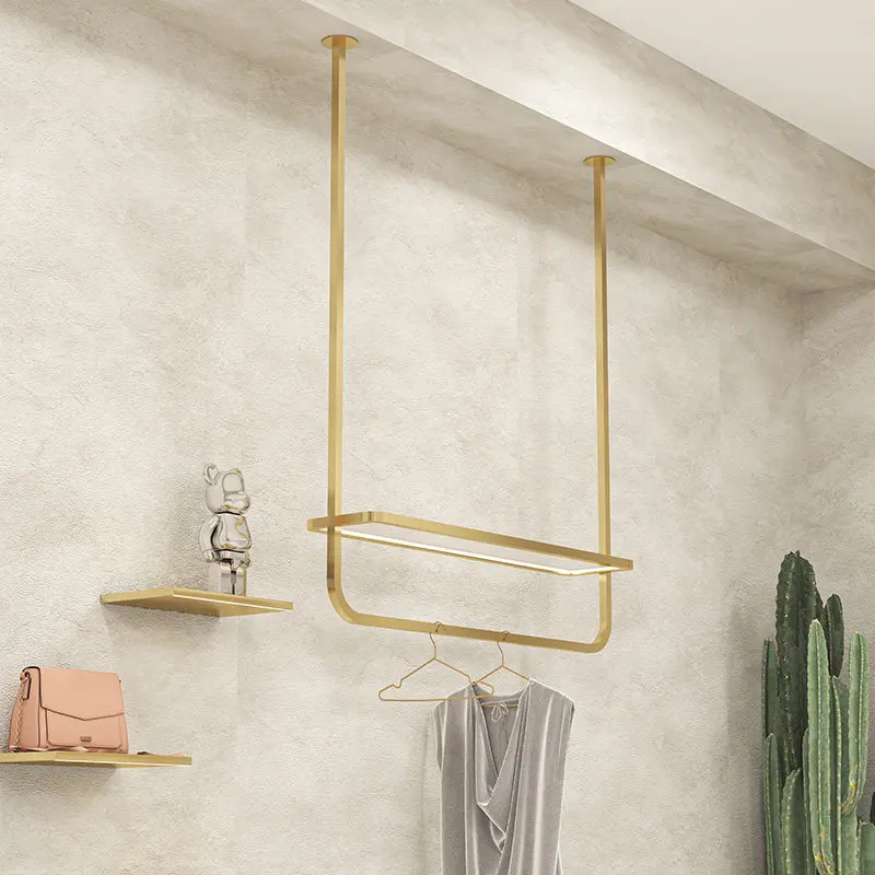 

Clothing store window display rack with lamp hanging on the wall Stainless steel gold middle island hanging clothes rack shoe