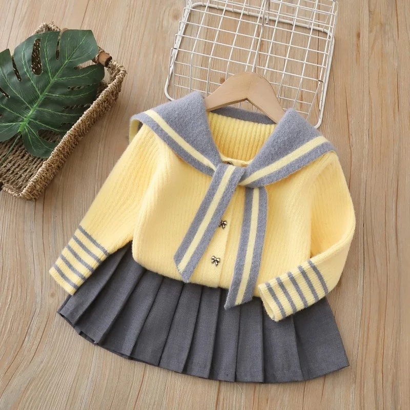 

2026 Spring Kids Girls Preppy Outfit Children Girl Navy Collar Spliced Knit Sweater 2PCS Bow Button Baby Girl Pleated Skirt Suit