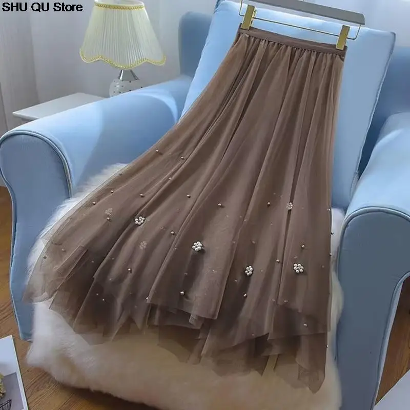 تنورة شاش مطرزة غير منتظمة جديدة لعام 2025 للنساء بخصر عالٍ تنورة عصرية تناسب الجميع على شكل حرف a متوسطة الطول بطول الإناث