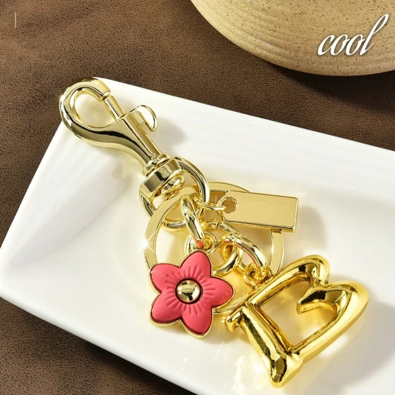 

Cute flower letter key chains, flower keychains, cherry blossom and plum blossom pendants, and ladies' bag pendants