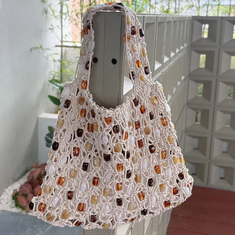 

Versatile summer woven hollow contrasting color beaded design portable shoulder bag underarm bag