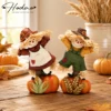 Hodao Set of 2 Fall Harvest Scarecrow Figurines, Resin Thanksgiving Pumpkin Decor, Hand-Painted Dancing Farmer Couple Statue with Cute Sunflower Accents, Fall Collectible Ornament, Seasonal Holiday Gift for Indoor, Patio, and Yard Home Display 1