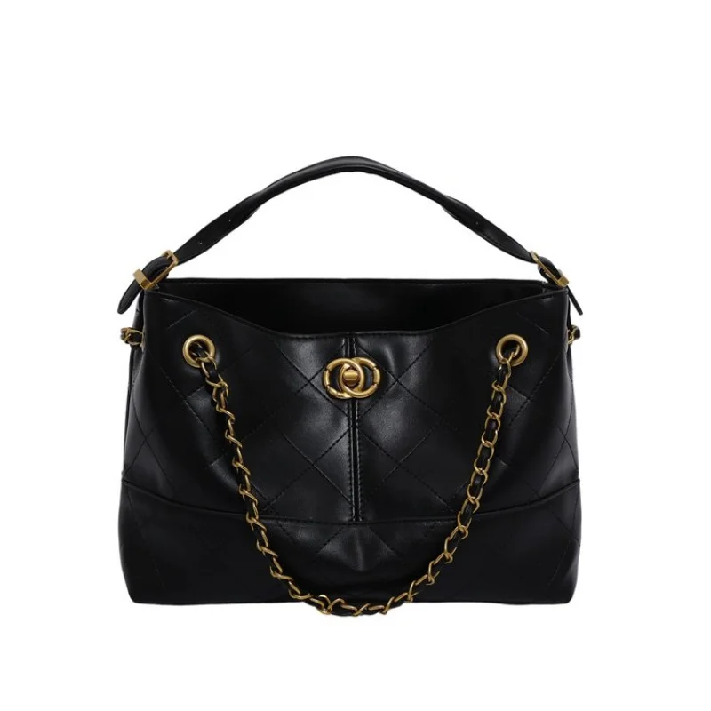 

Женская сумка с замком в парижском стиле с фирменной фурнитурой и высококачественной галькированной кожей