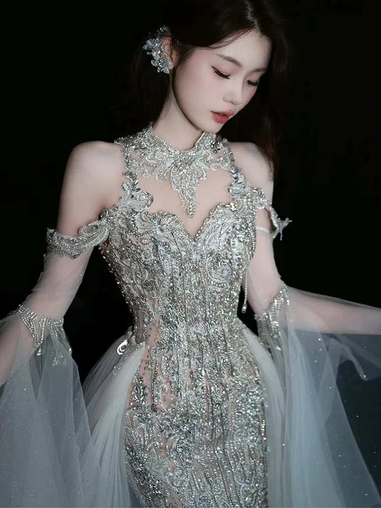 

New fitted fishtail wedding dress with a heavy trailing