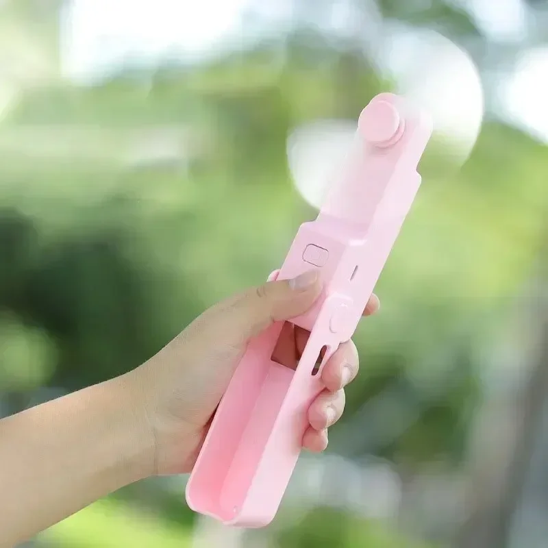 

New Handheld Small Fan Portable Creative Mini Three Speed Adjustable Solid Color Charging Folded Fan LED Lighting Phone Holder