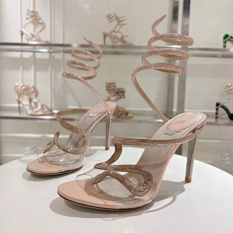 صنادل نسائية صيفية مزخرفة بالكريستال على شكل ثعبان بحزام مطاطي من Sandalias PVC شفافة بحزام واحد وكعب رفيع