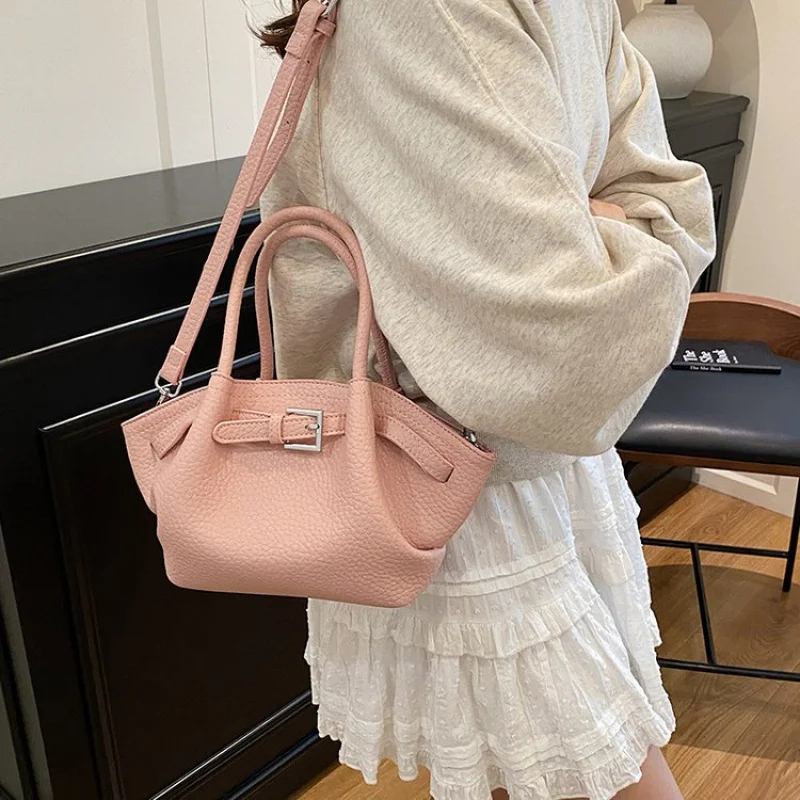 

Vintage Inspired Women Handbag With Carved Floral Design And Leather Fringe Details For Bohemian Style