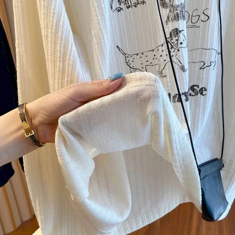 T-shirt con scollo a O Estetica oversize Design cartoon Top eleganti Vintage Casual stile americano Manica lunga Autunno Abbigliamento donna