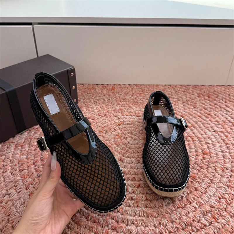 The new espadrille features a fishnet upper with subtle embellishments and patent leather trim buckle straps Leather and textile