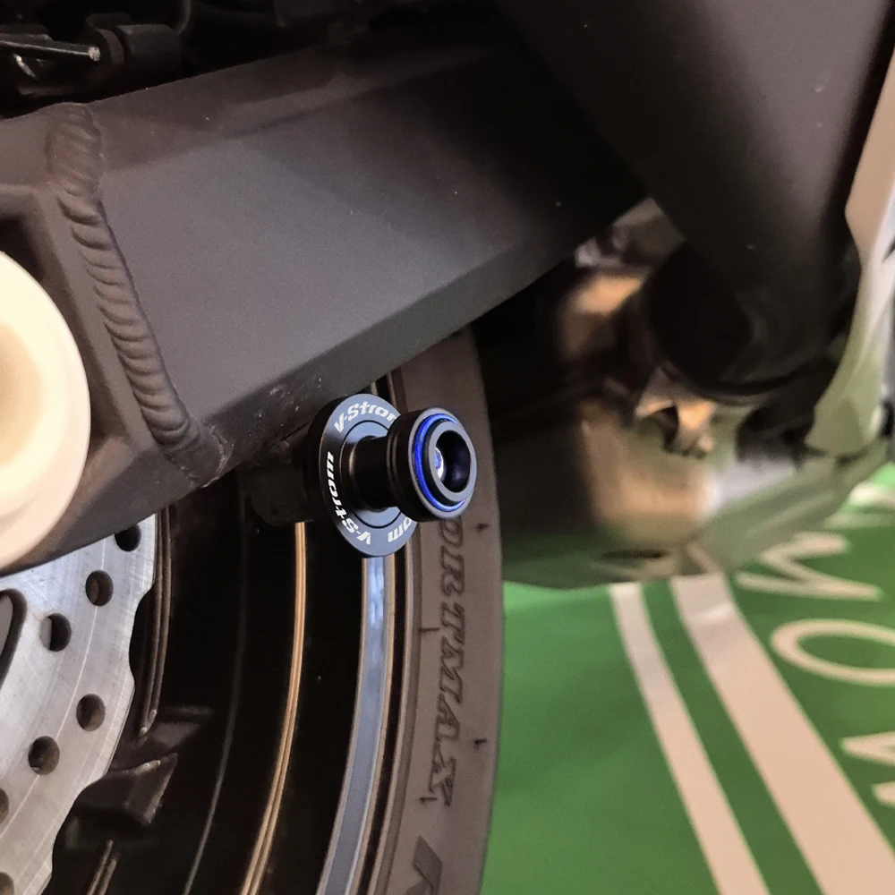 لسوزوكي فستروم 800DE 1050DE V-StromV ستروم 650 1000 1050 XT دراجة نارية Swingarm بكرات المنزلق حامل مسامير قبعات صمام الإطارات