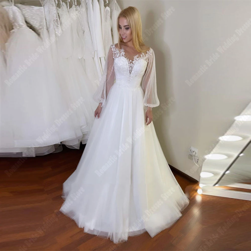 Affascinanti abiti da sposa da donna con stampa in pizzo abiti da sposa Vintage a maniche lunghe con scollo a v superficie in Tulle Princess Vestidos De Novia