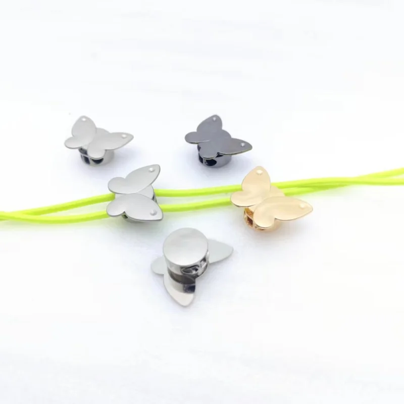 

Craft Parts Adjustment Plating 10pcs Cord Lock Zinc alloy Nylon Stopper Cord Lock for Hat Cord End Sportswear Shoes Rope butterf