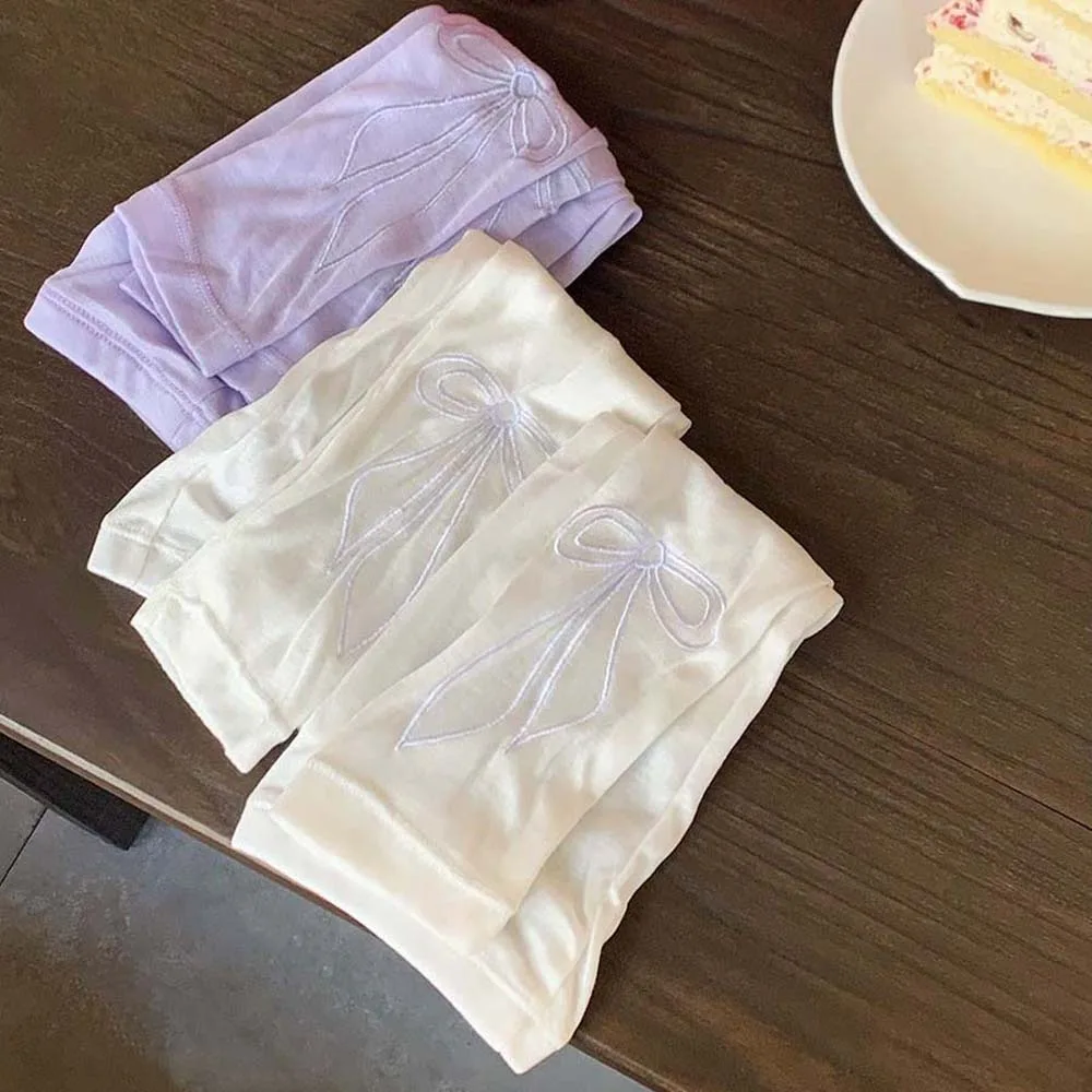 Maniche di ghiaccio alla moda con fiocco dolce ricamate maniche lunghe traspiranti stile coreano sottili coperture per protezione solare per braccio ad asciugatura rapida Sport