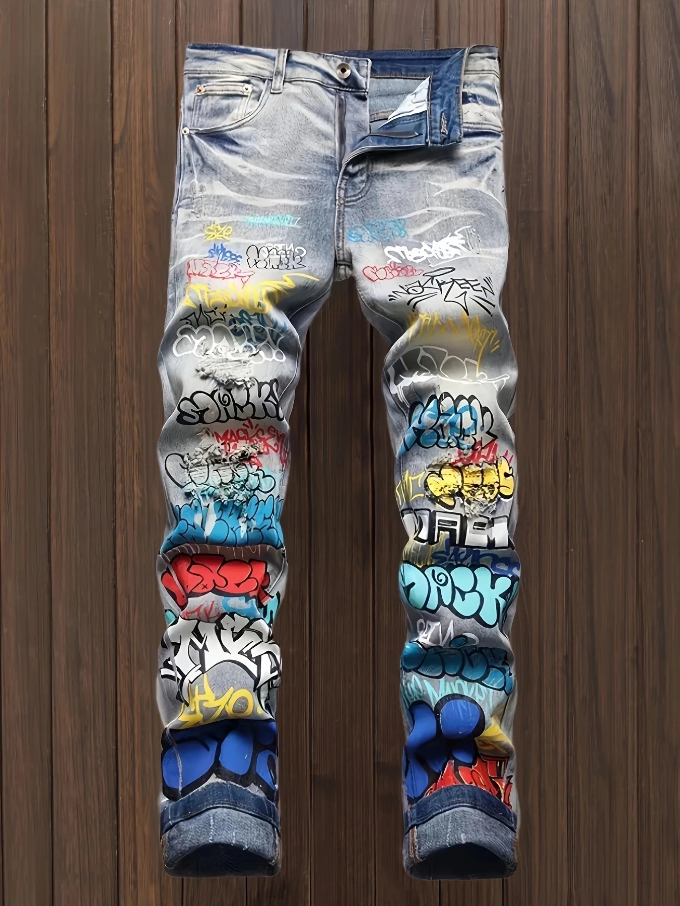 

European and American printed graffiti old washed and ripped jeans