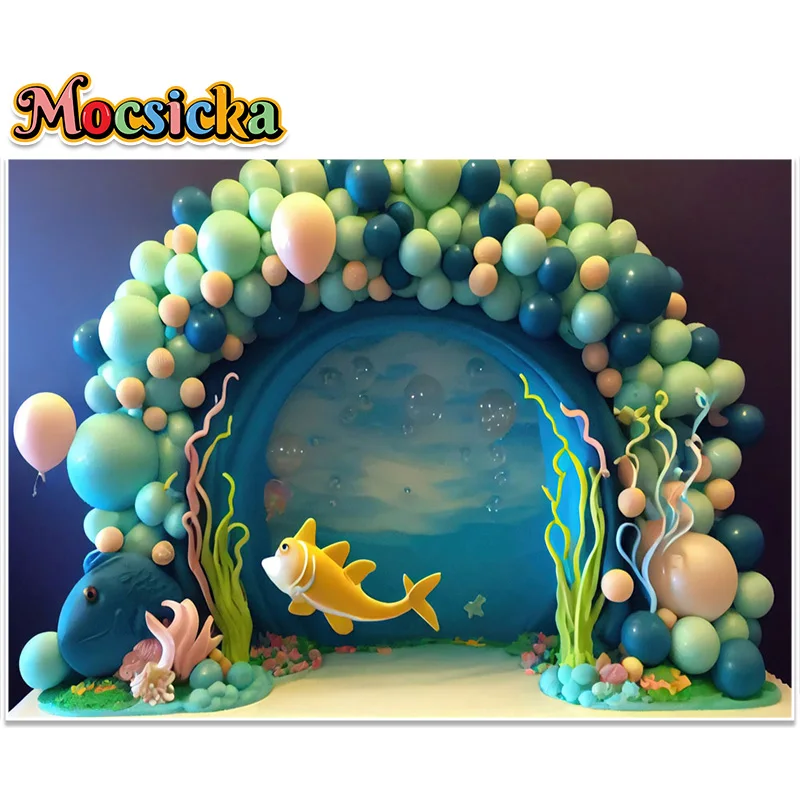 Ocean Theme Photography Background Golden Yellow Fish Swimming Through Green Balloon Arch Surrounded By Water Plants Backdrop