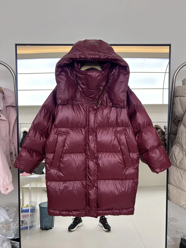 سترة نسائية طويلة بغطاء للرأس فضفاضة بيضاء مبطنة للأسفل سترة عصرية لشتاء 2025 معطف جديد بزرين على شكل قرن البقر بلون سادة #2