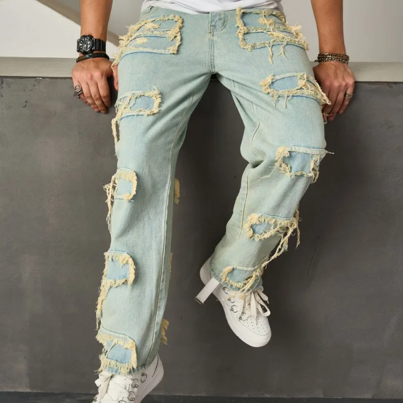 Nuovi pantaloni da uomo casual a gamba larga alla moda con barba sciolta in denim bionico con toppa in tessuto cucito strappato