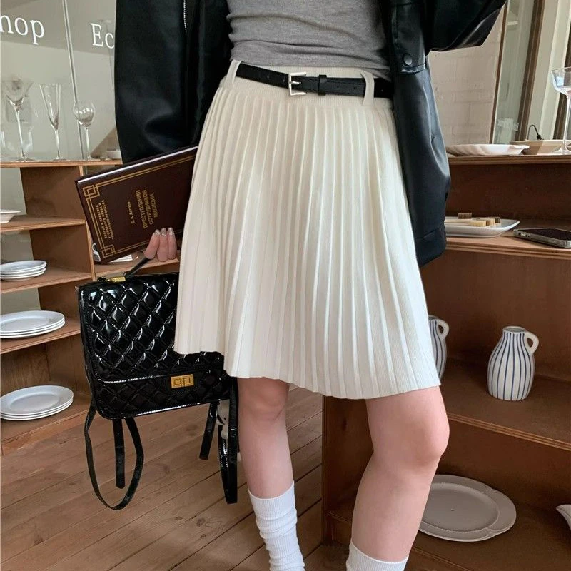 Rimocy Preppy สไตล์ถักกระโปรงมินิกระโปรงผู้หญิง 2025 ฤดูใบไม้ผลิเอวสูงจีบกระโปรงสั้นผู้หญิงกระโปรงสายกับเข็มขัด