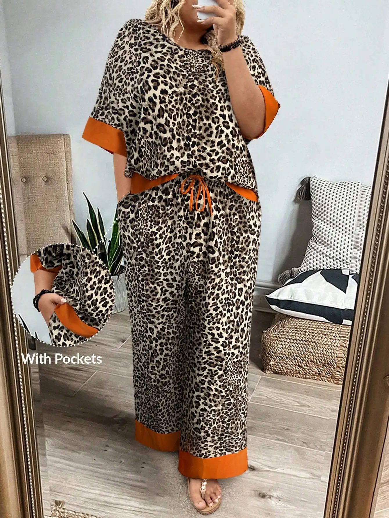 

Комплект из двух предметов больших размеров с леопардовым принтом и оранжевой отделкой: топ с коротким рукавом и широкие брюки, повседневный наряд для отпуска