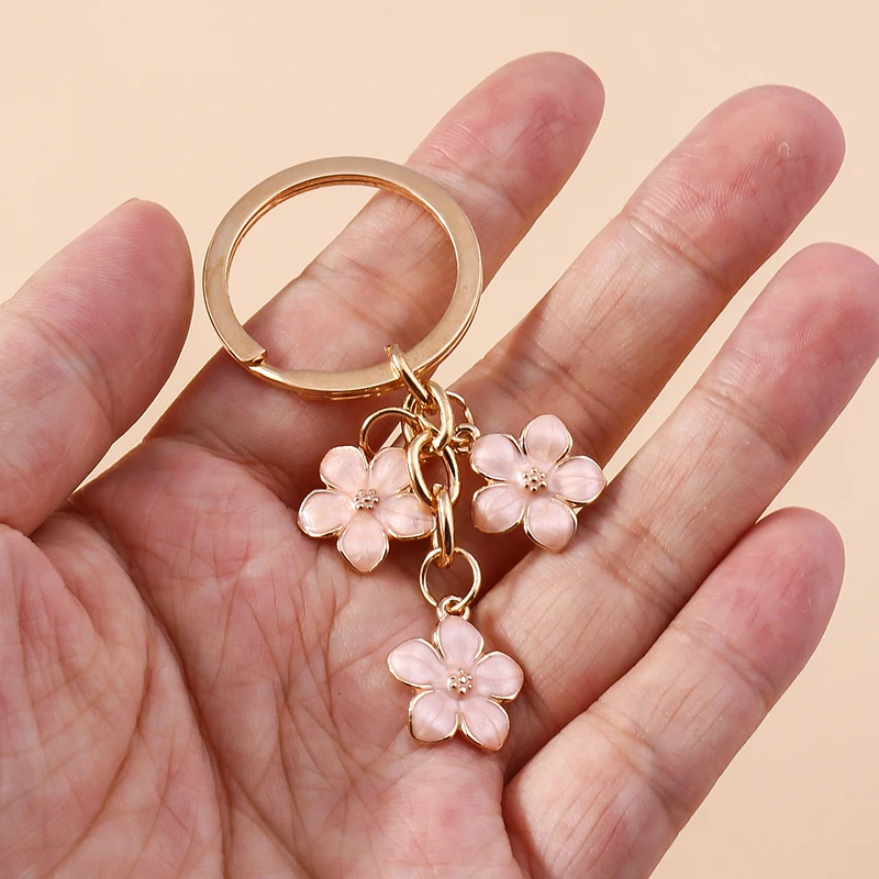 Aihua 40 Farben Niedlicher Pflanzen-Schlüsselanhänger Emaille Sakura-Blumen-Schlüsselanhänger für Frauen Mädchen Handtasche Anhänger Autoschlüsselhalter DIY Schmuck Geschenke – Detail 9