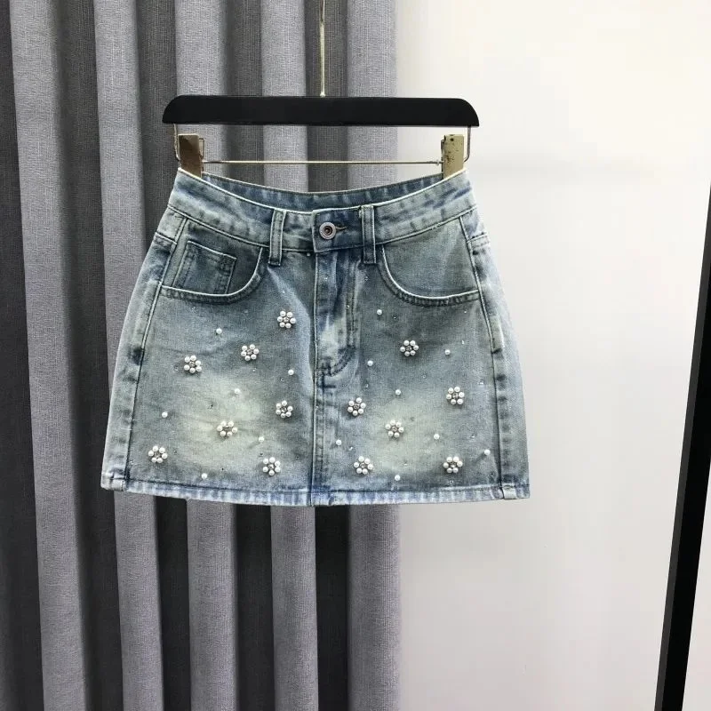 

Индивидуальная белая джинсовая юбка с высокой талией и бисером, женская летняя модная дикая возрастная юбка трапециевидной формы средней длины до бедра
