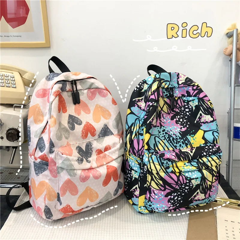 Nylon fabric lightweight graffiti student schoolbag, heart-shaped color-blocking large-capacity travel ladies' backpack