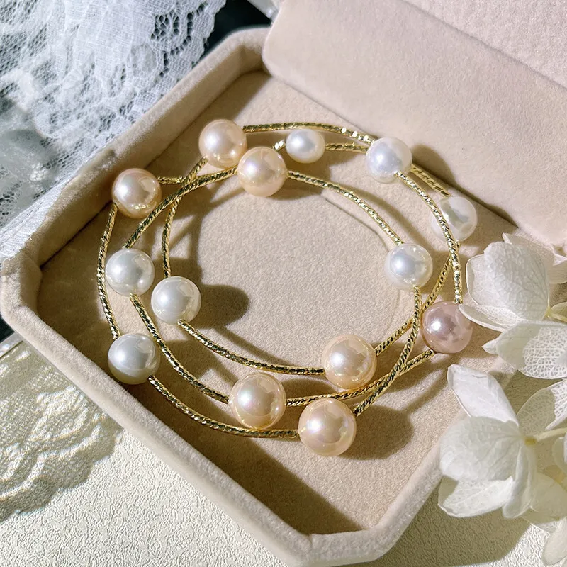 

Многослойный трехслойный жемчужный браслет в корейском стиле с перекрестной оберткой для женщин. Французский элегантный универсальный браслет можно использовать в качестве ожерелья.