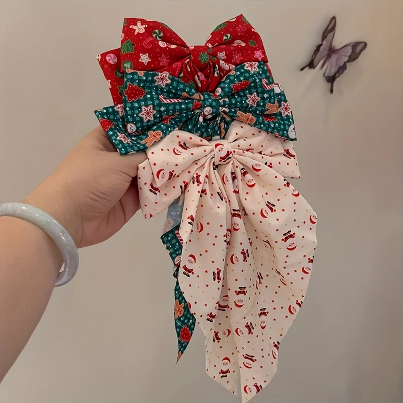 Weihnachts-Haarspangen mit doppellagiger Schleife für Weihnachtsmann und Schneemann – bedruckter Urlaubs-Haarschmuck mit roter und gestreifter Schleife aus Stoff – Detail 1